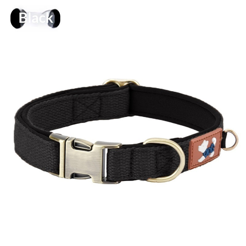 Black padded dog collar with adjustable webbing, metal buckle and leash D-ring