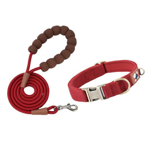 Red padded dog collar with matching rope leash and cushioned loop handle