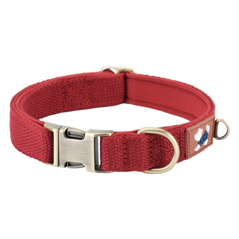 Red padded adjustable dog collar with metal quick-release buckle and D-ring
